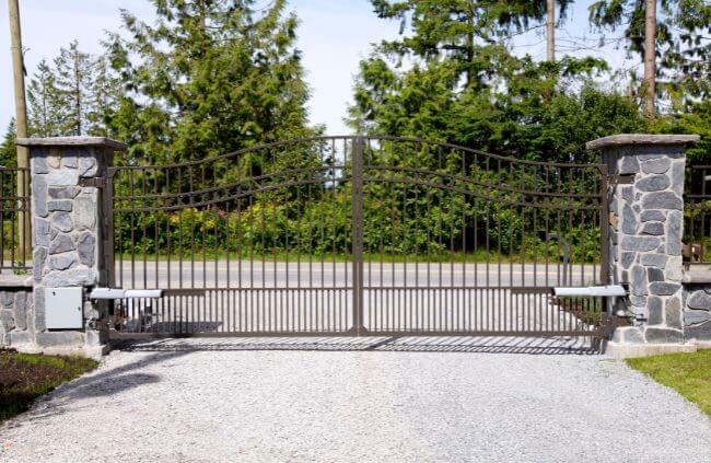 Automatic swing gate installation by Auto Gate Guys Perth featuring double wrought-iron driveway gates for secure access.